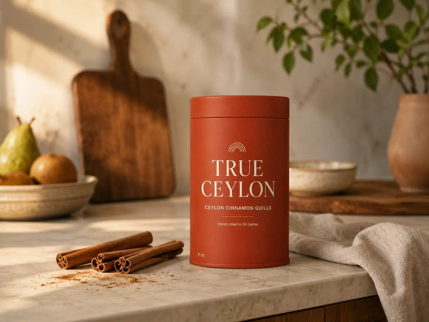 True Ceylon tin with whole Ceylon cinnamon quills on a warm kitchen counter